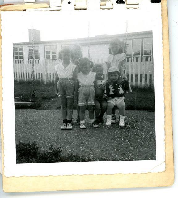 Donna, Debbie & cousins on swings at PE school