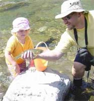 Jordyn teaching Jimi how to fish